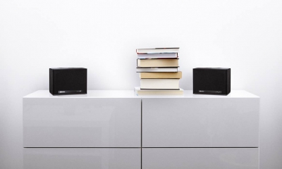 white commode with stack of books in bright minimalism interior
