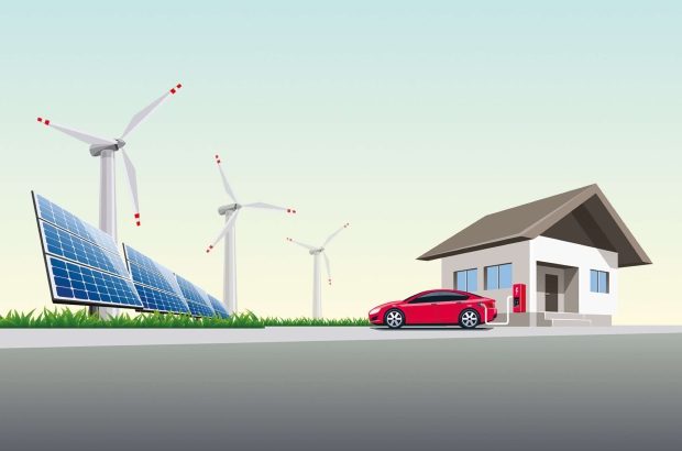 Electric Car Charging at the Charging Wall Station near House