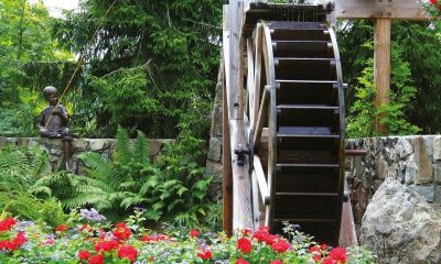 Waterwheel,In,A,Spring,Time,Flower,Garden.